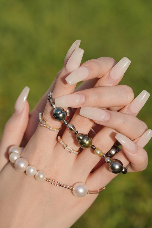 What do Tahitian pearls symbolize?